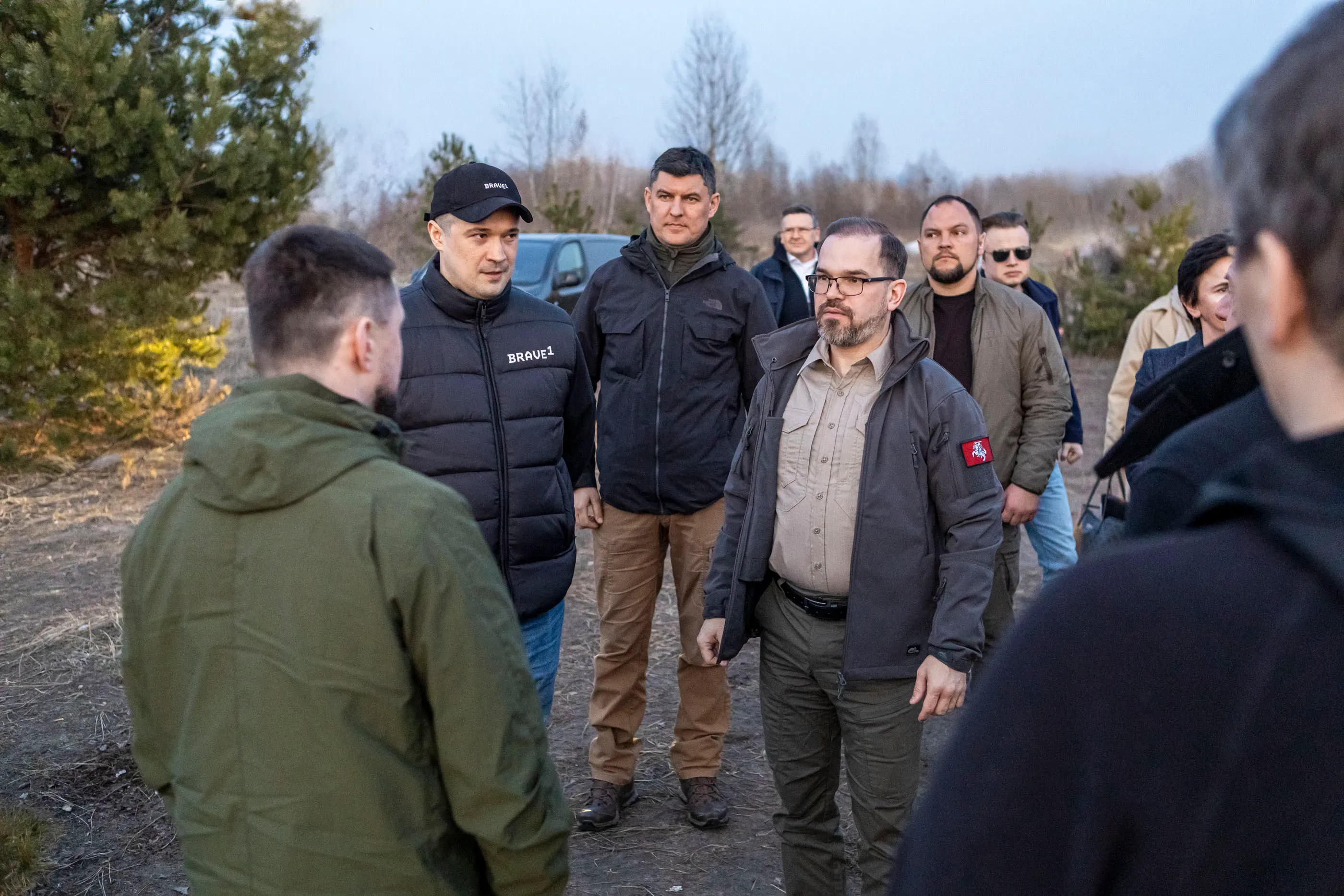 Mykhailo Fedorov, Robertas Kaunas, and the delegation during a visit to mobile fire group positions