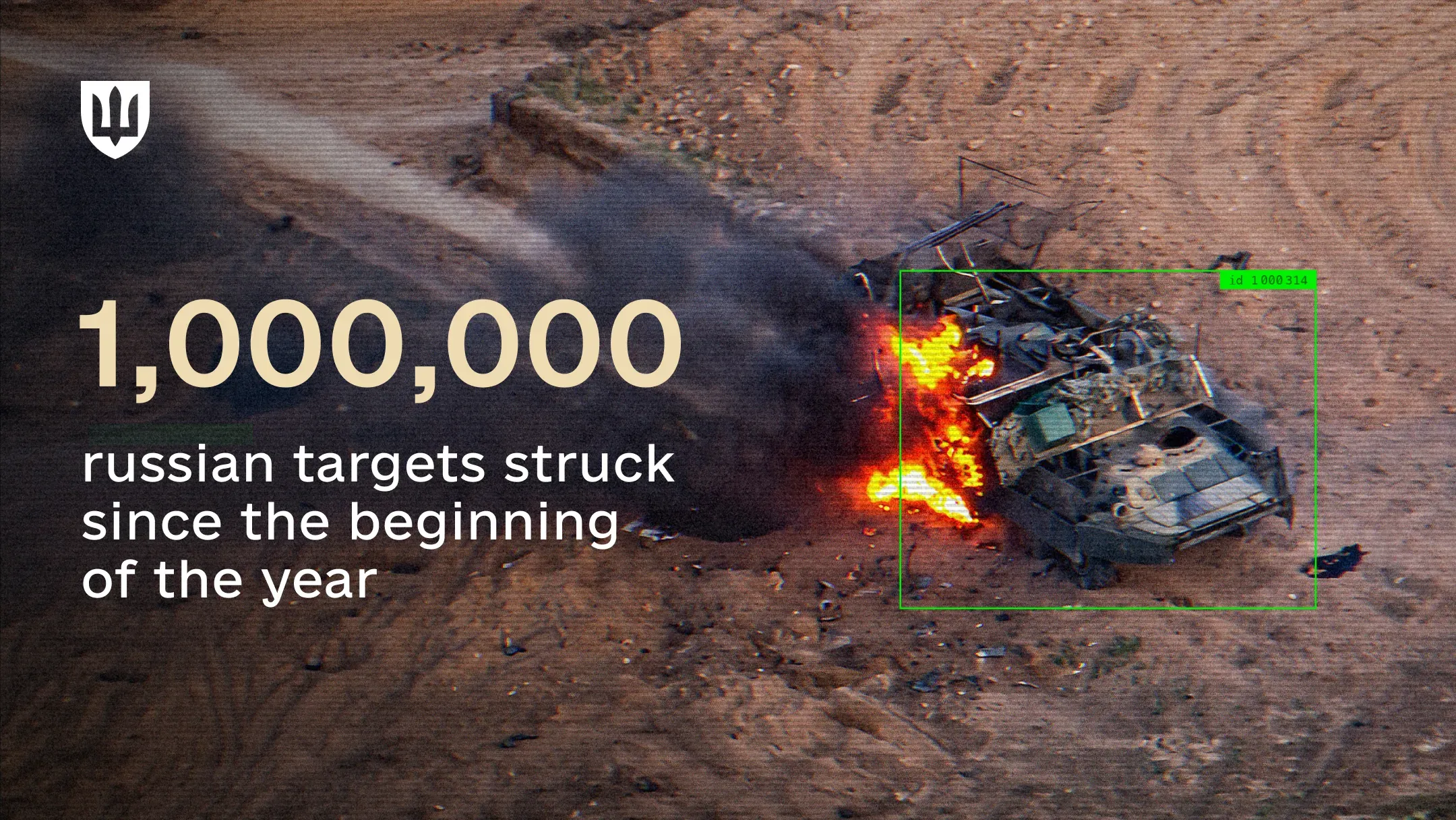 Drone view of a burning military vehicle within a green automatic target tracking frame.
