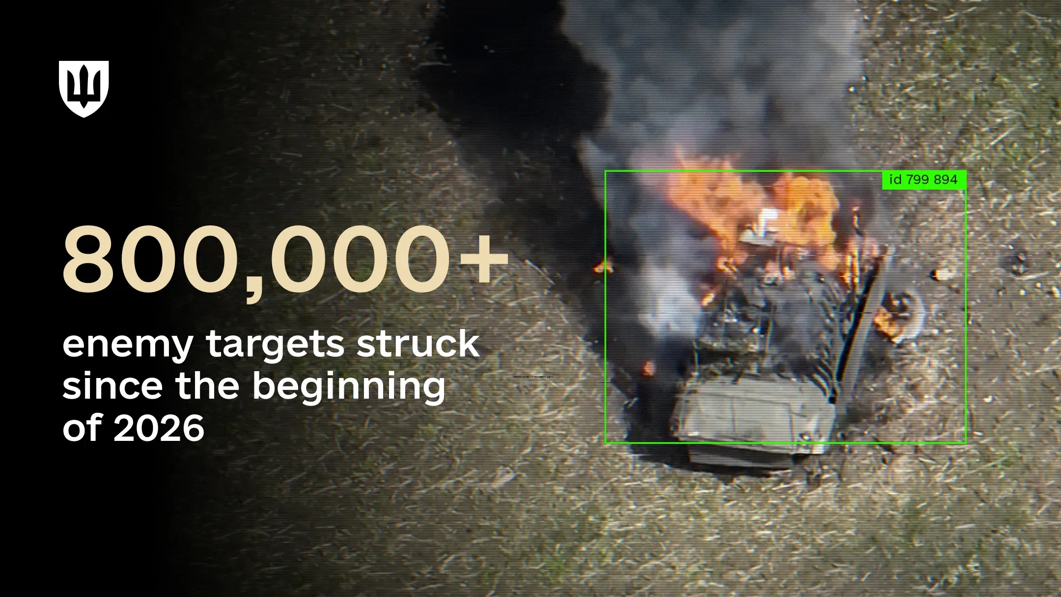 An aerial image showing a military vehicle on fire during combat operations