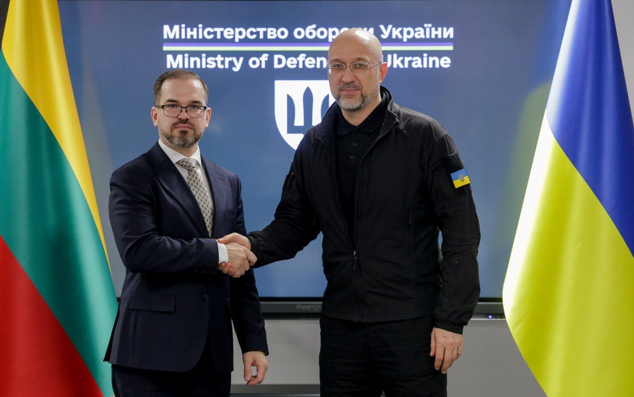 Lithuania’s Minister of National Defence Robertas Kaunas and Ukraine’s Minister of Defence Denys Shmyhal shake hands during their meeting in Kyiv