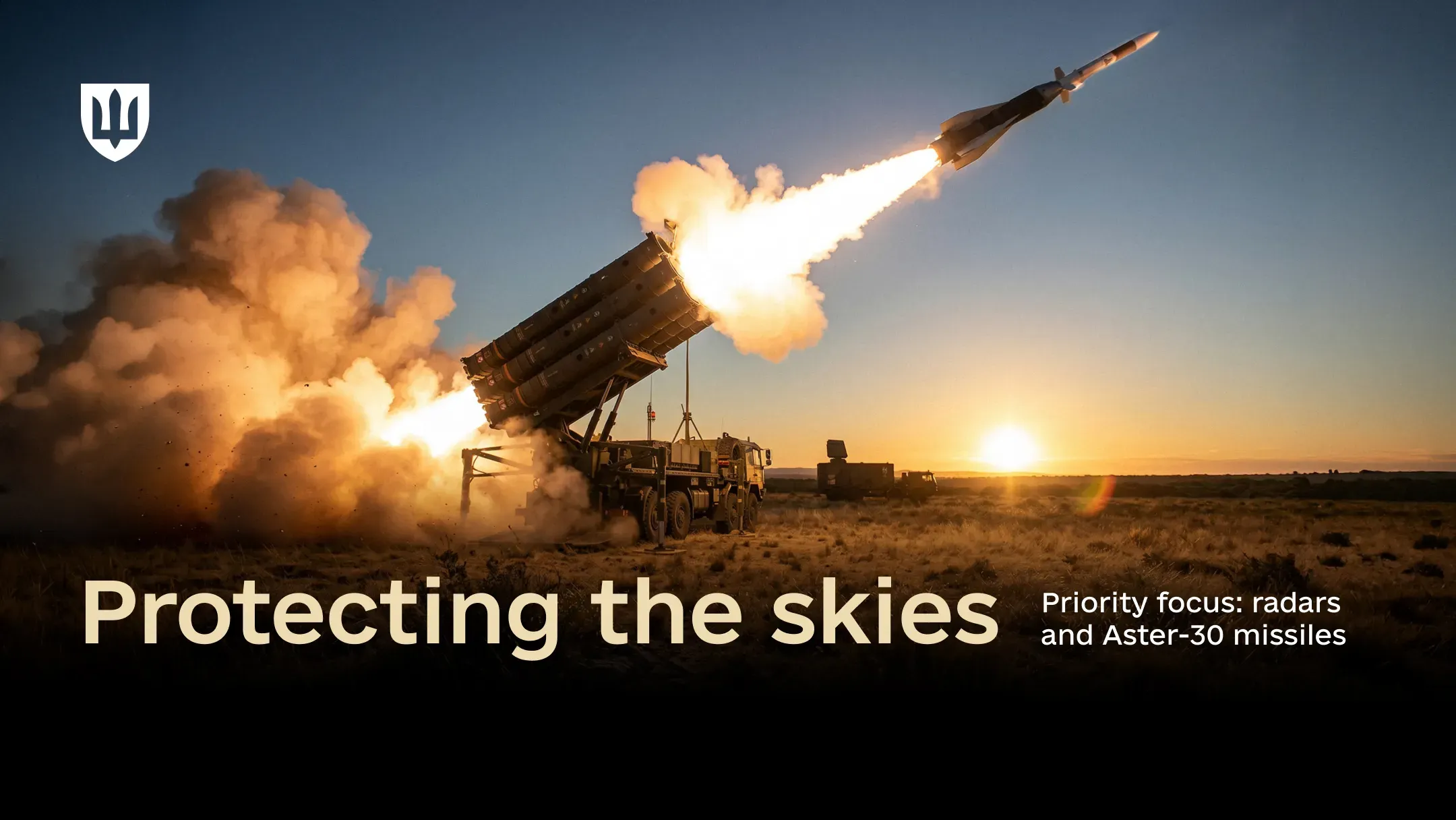 An Aster-30 surface-to-air missile launches from a mobile launcher as the sun sets on the horizon