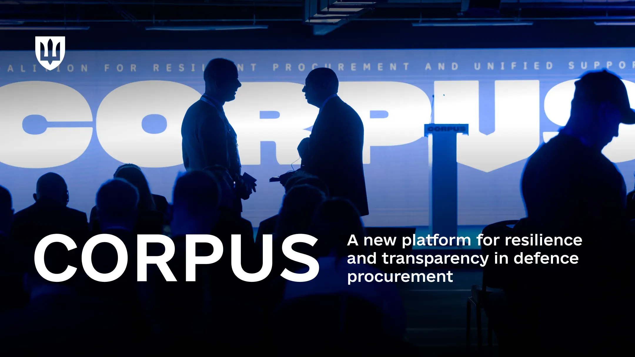 Silhouettes of attendees standing against the backdrop of the CORPUS coalition logo