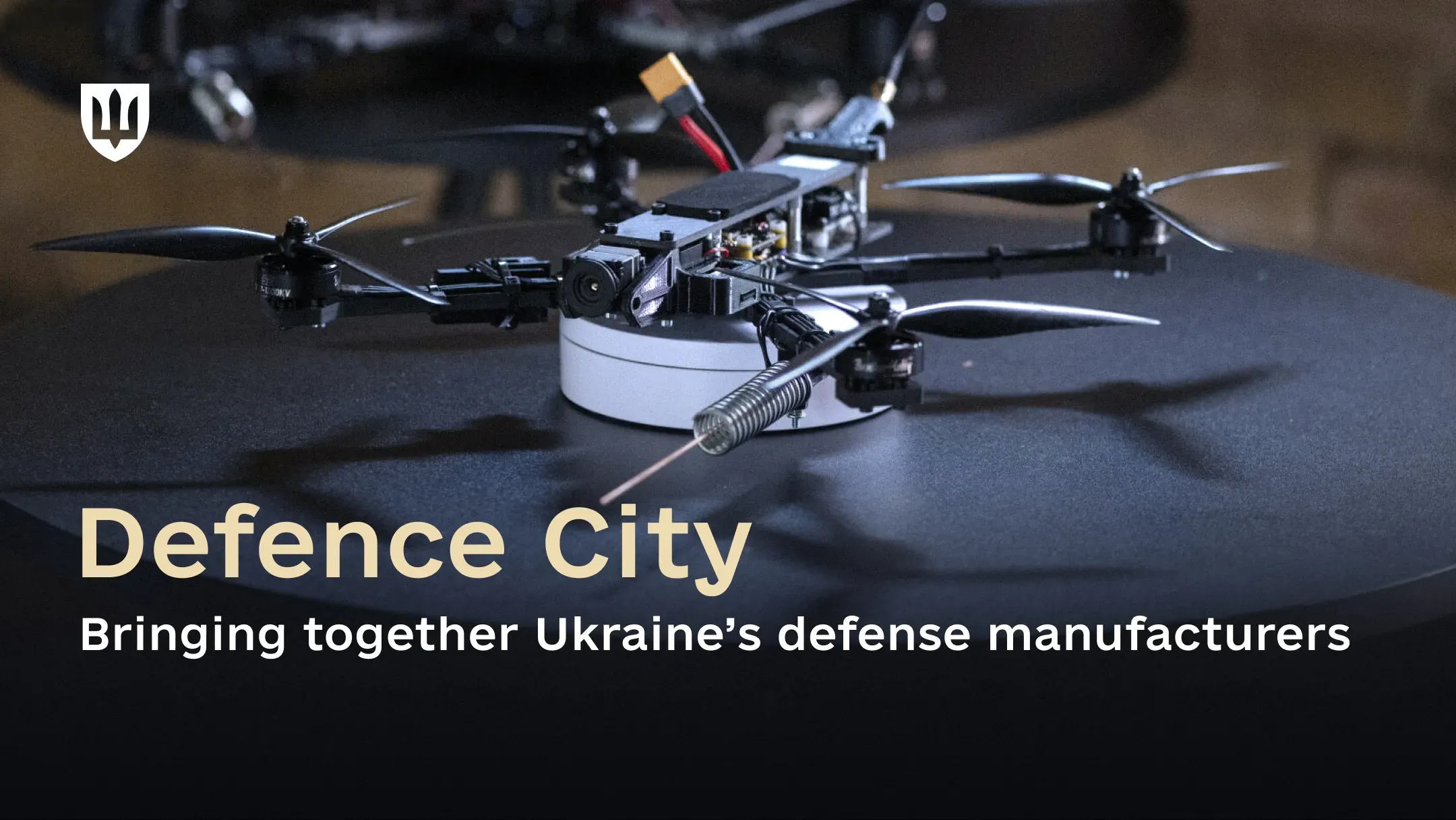 A Ukrainian military quadcopter is displayed alongside the text: “Defence City: Bringing together Ukraine’s defense manufacturers.”
