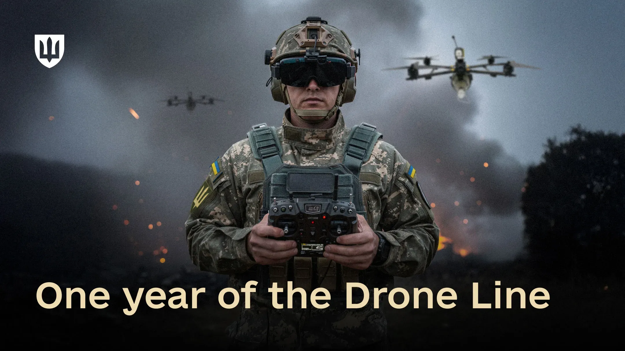A Ukrainian service member operates a drone against the backdrop of destroyed russian military equipment. The text on the image reads: “One year of the ‘Drone Line’ initiative”