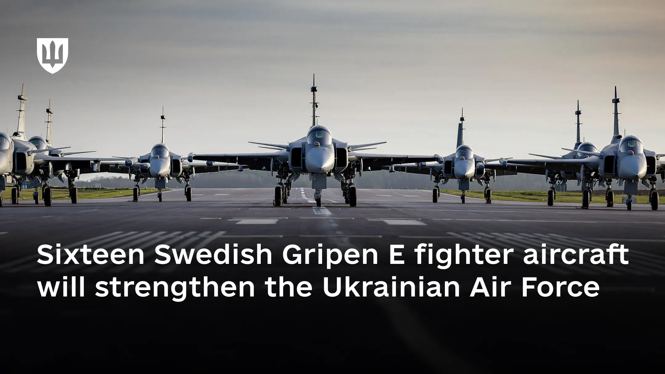 Several Swedish Gripen multirole fighter aircraft lined up on a runway