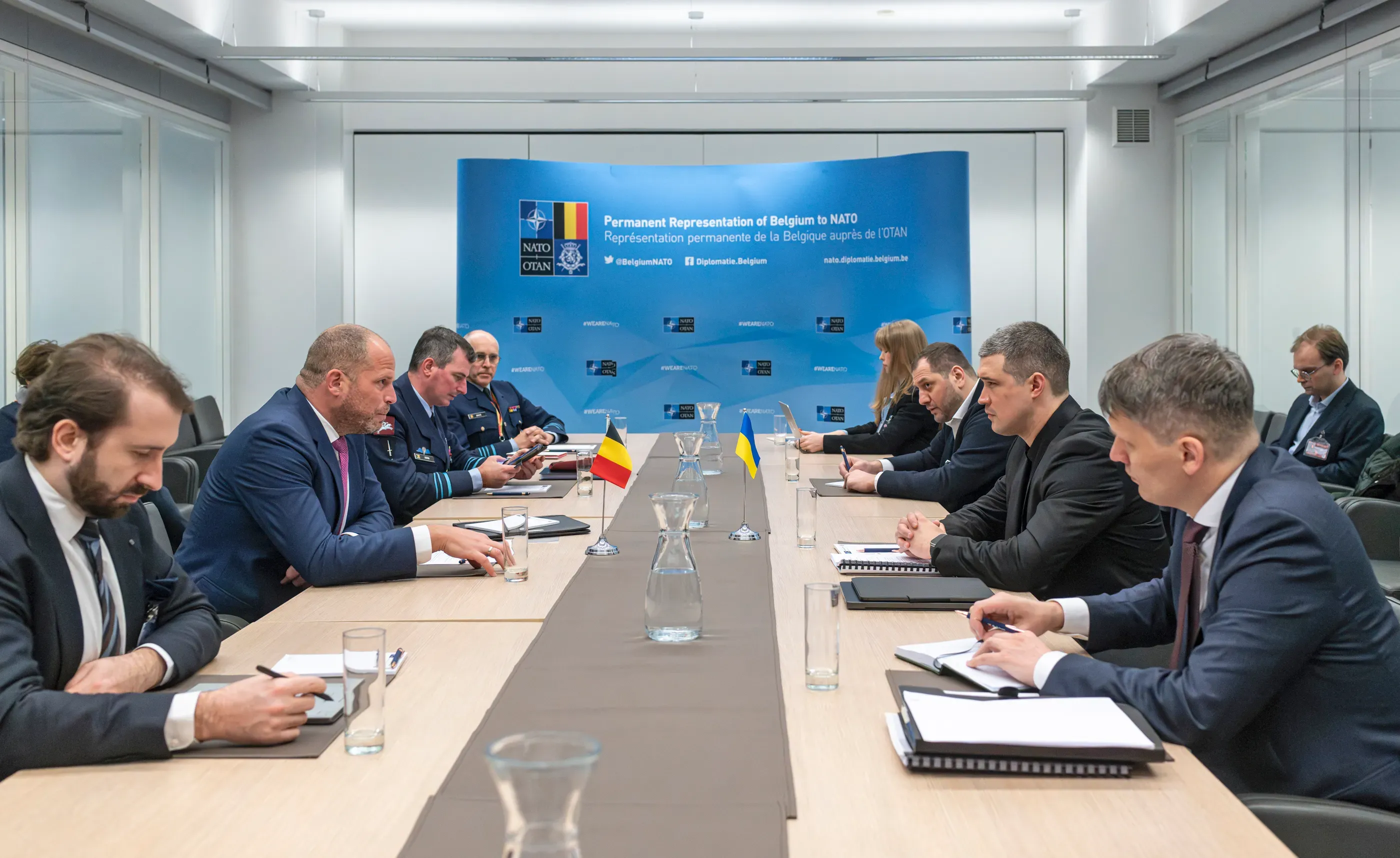 The Ministry of Defence of Ukraine delegation, led by Minister Mykhailo Fedorov, is seated at the table during discussions with partners at the Ramstein-format meeting