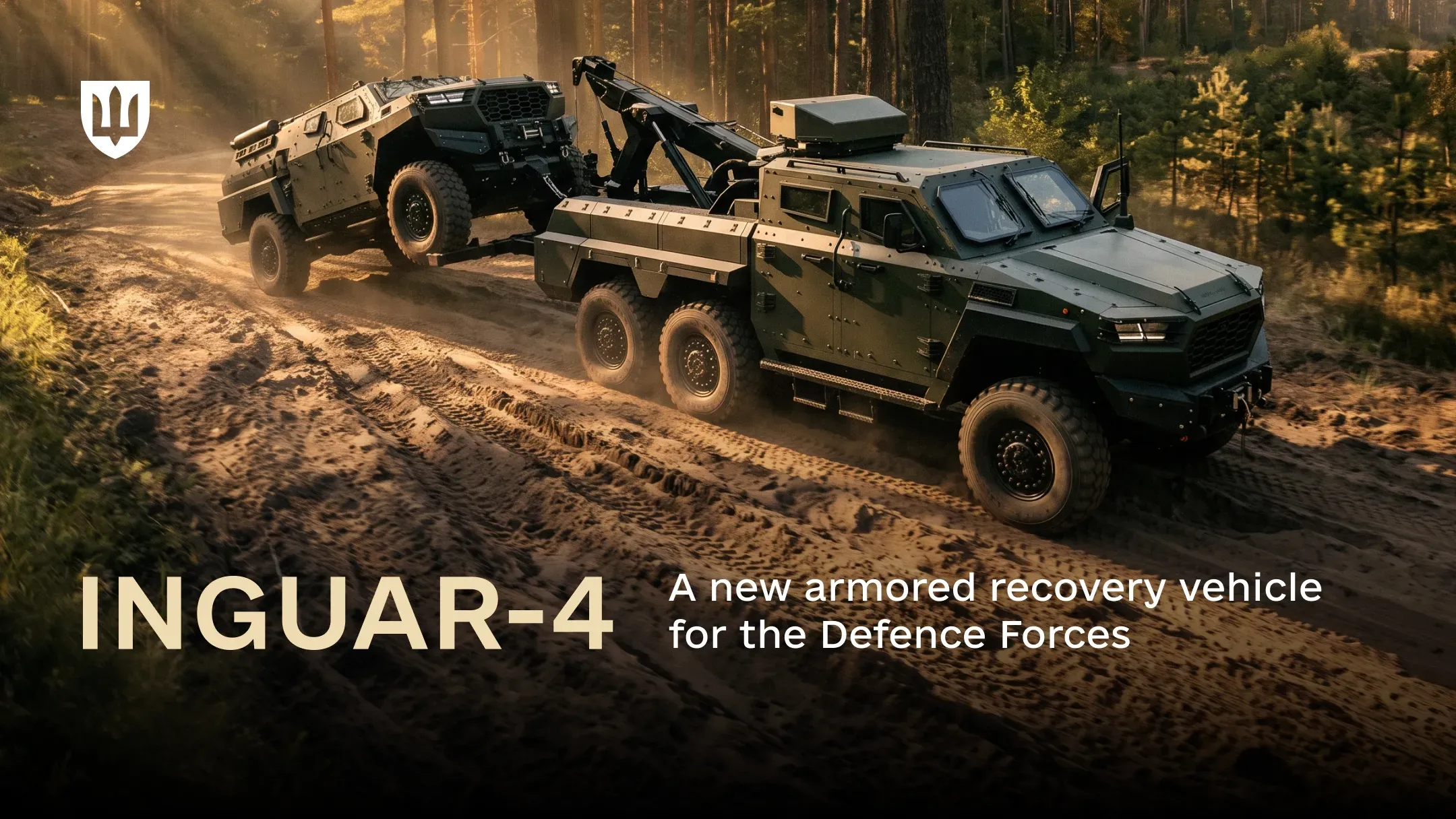 An INGUAR-4 armored recovery vehicle tows a damaged armored vehicle out of a wooded area