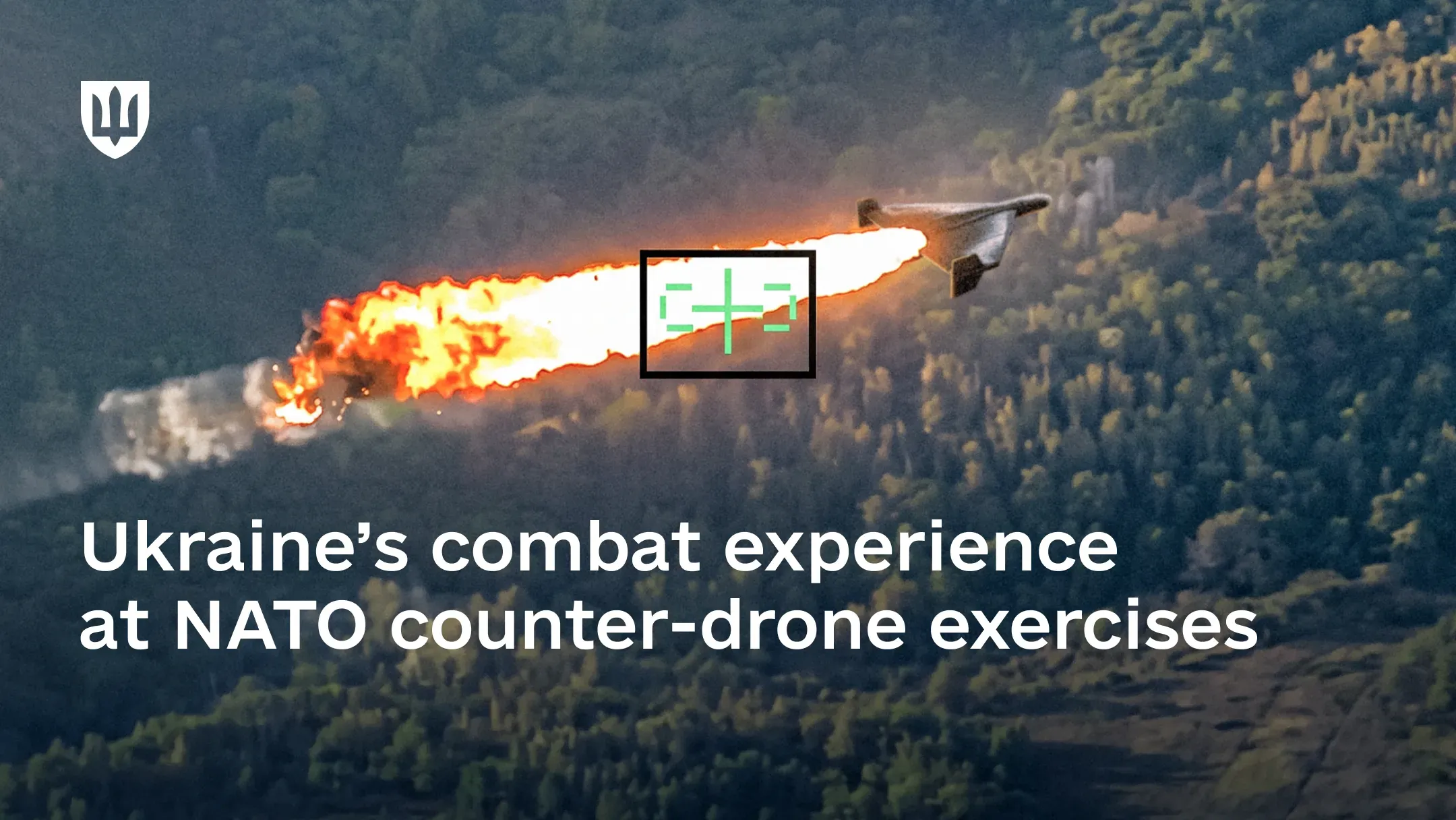 Drone trailing flames over a wooded area, framed in a targeting reticle
