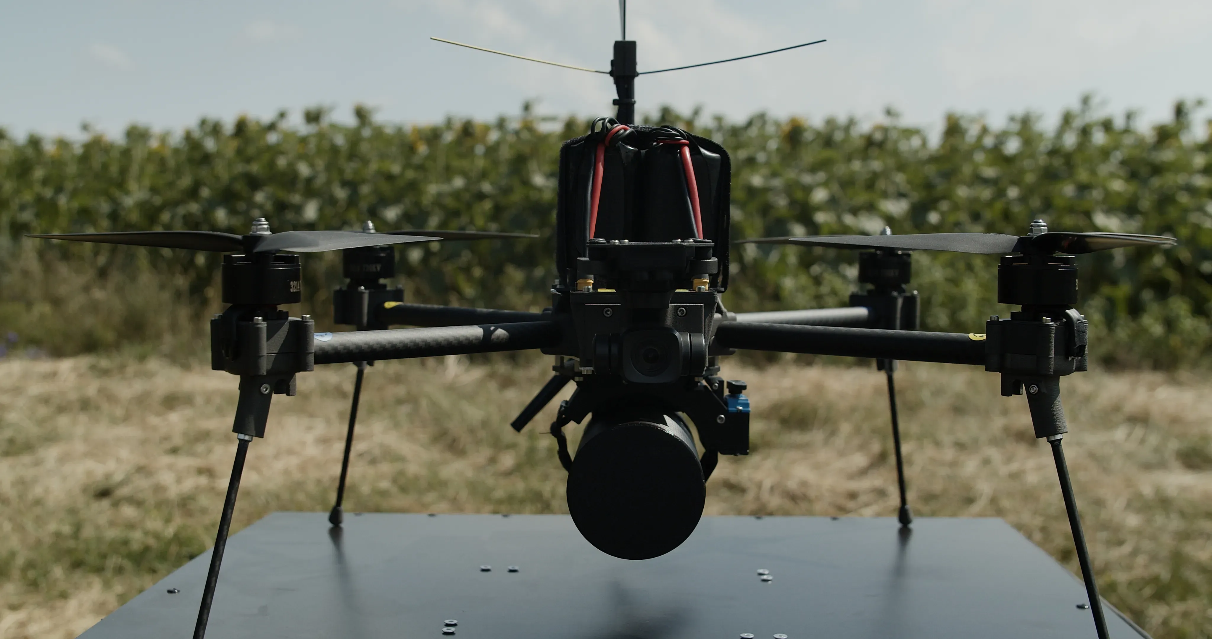 The Linza unmanned aerial vehicle is displayed on a table in a field