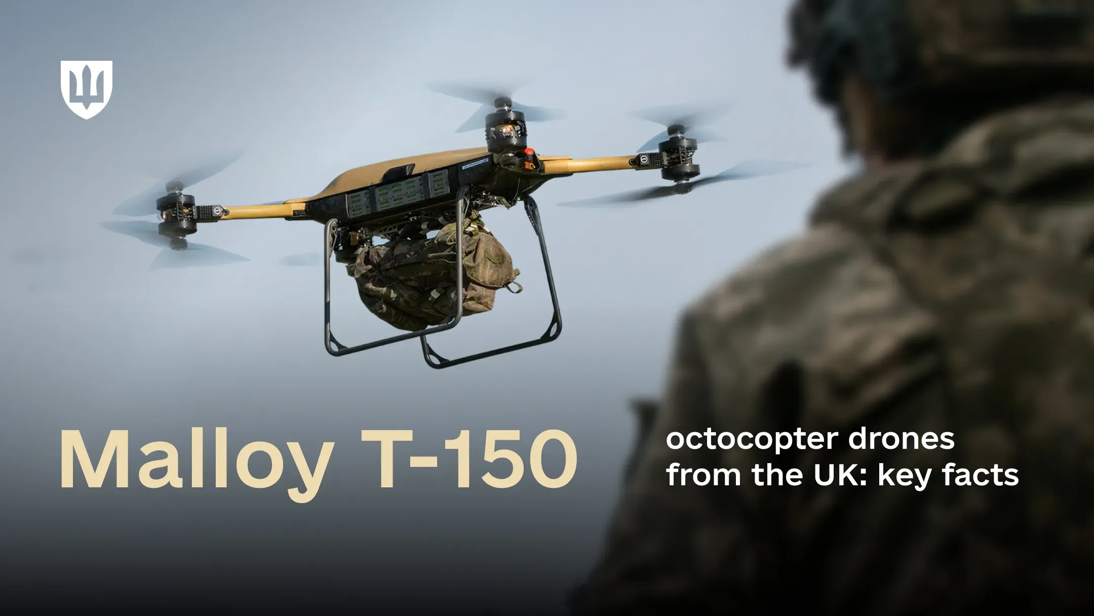A Malloy T-150 heavy-lift military drone is flying over a misty landscape, carrying a large camouflage tactical backpack suspended beneath it. In the foreground, a uniformed service member observes the flight.
