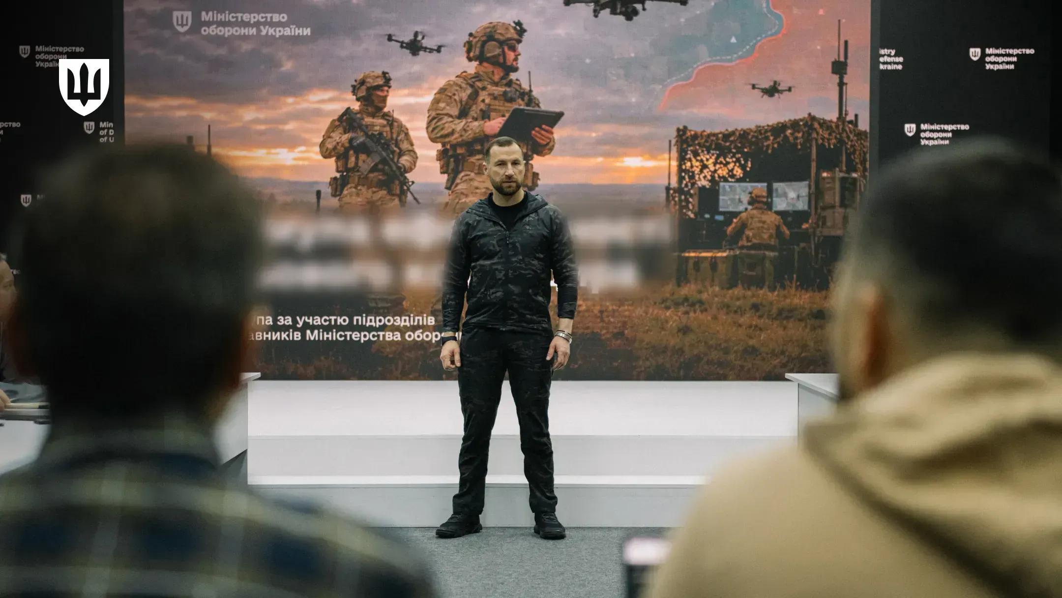 Evgeniy Khmara addresses service members at a meeting on frontline experience, evolving technologies, and strike assets