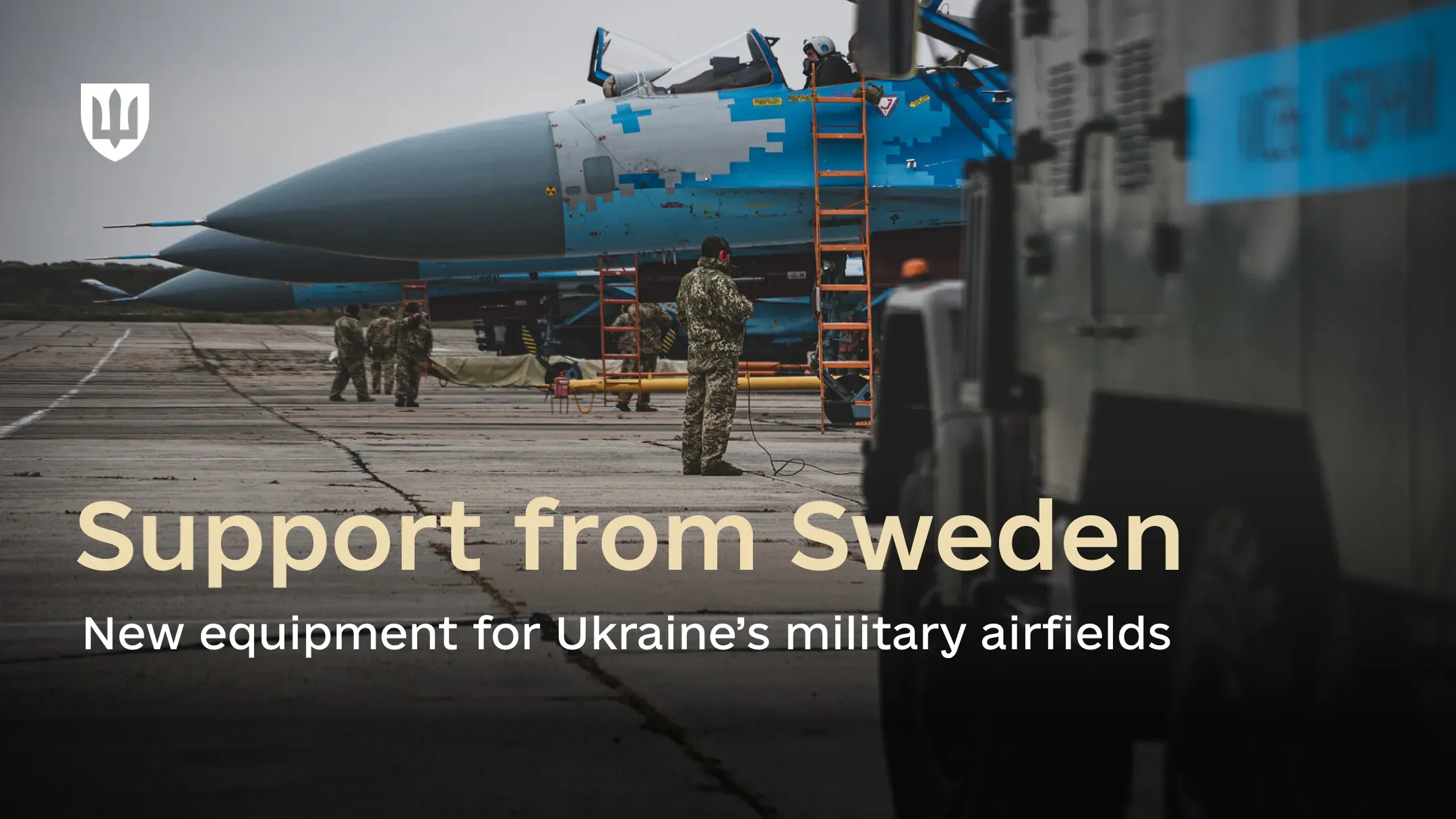 Ukrainian Su-27 fighter jets at an airfield with technical personnel