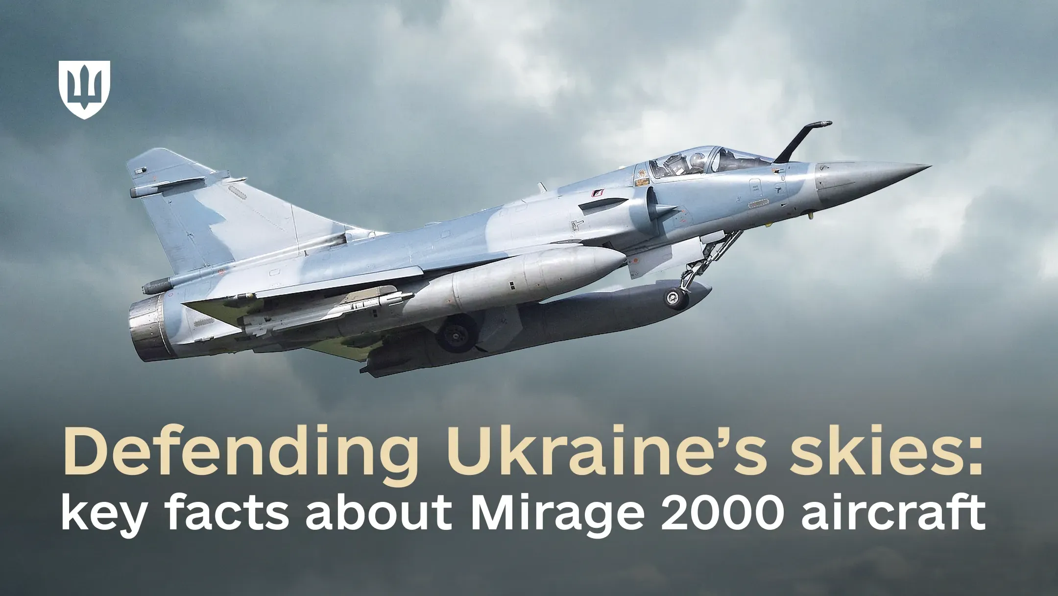 A French Mirage 2000 fighter aircraft in flight against a cloudy sky.