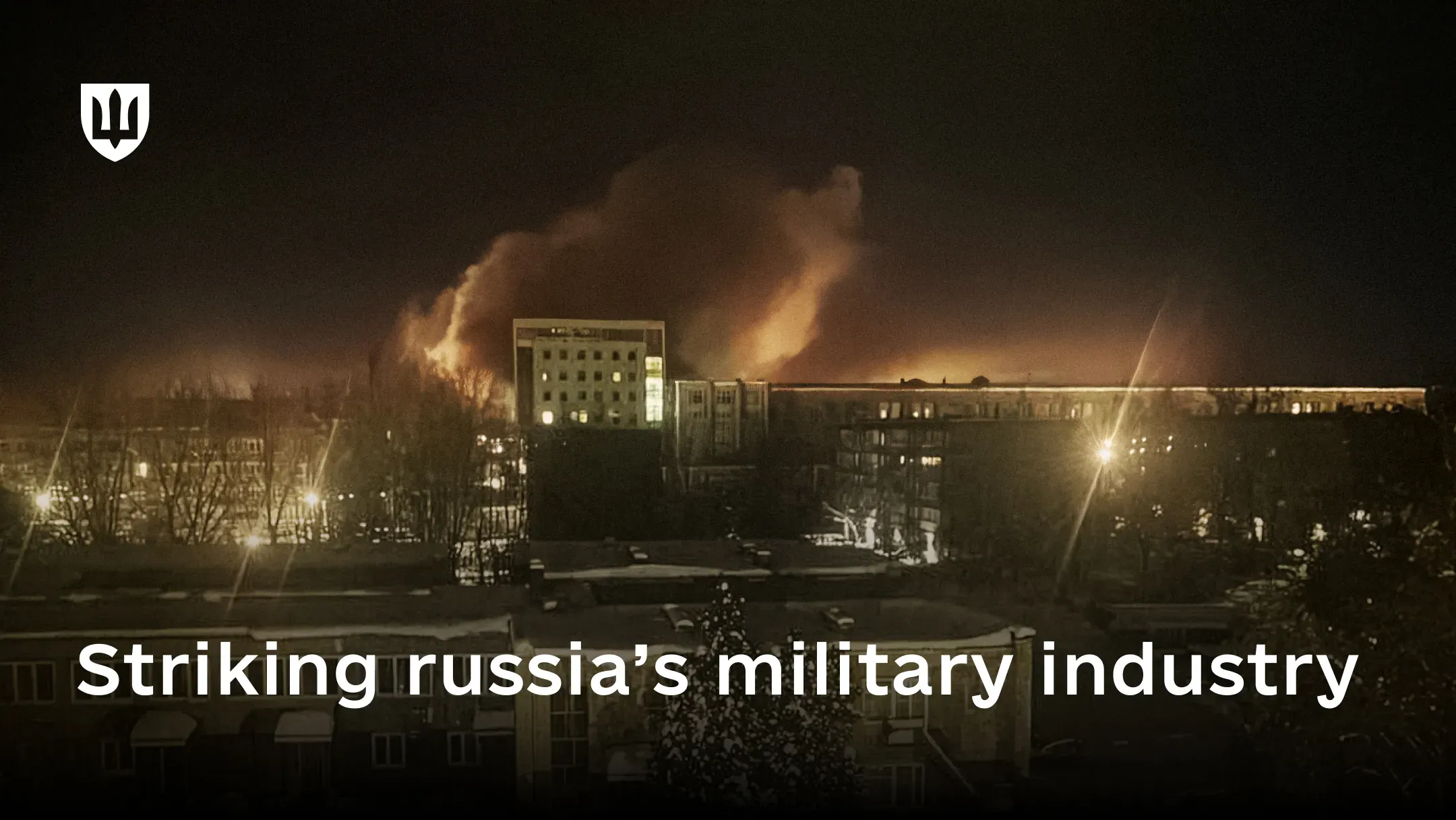 Night-time photo of a fire at the Michurinsk Progress Plant, with a large column of fire and smoke in the background.