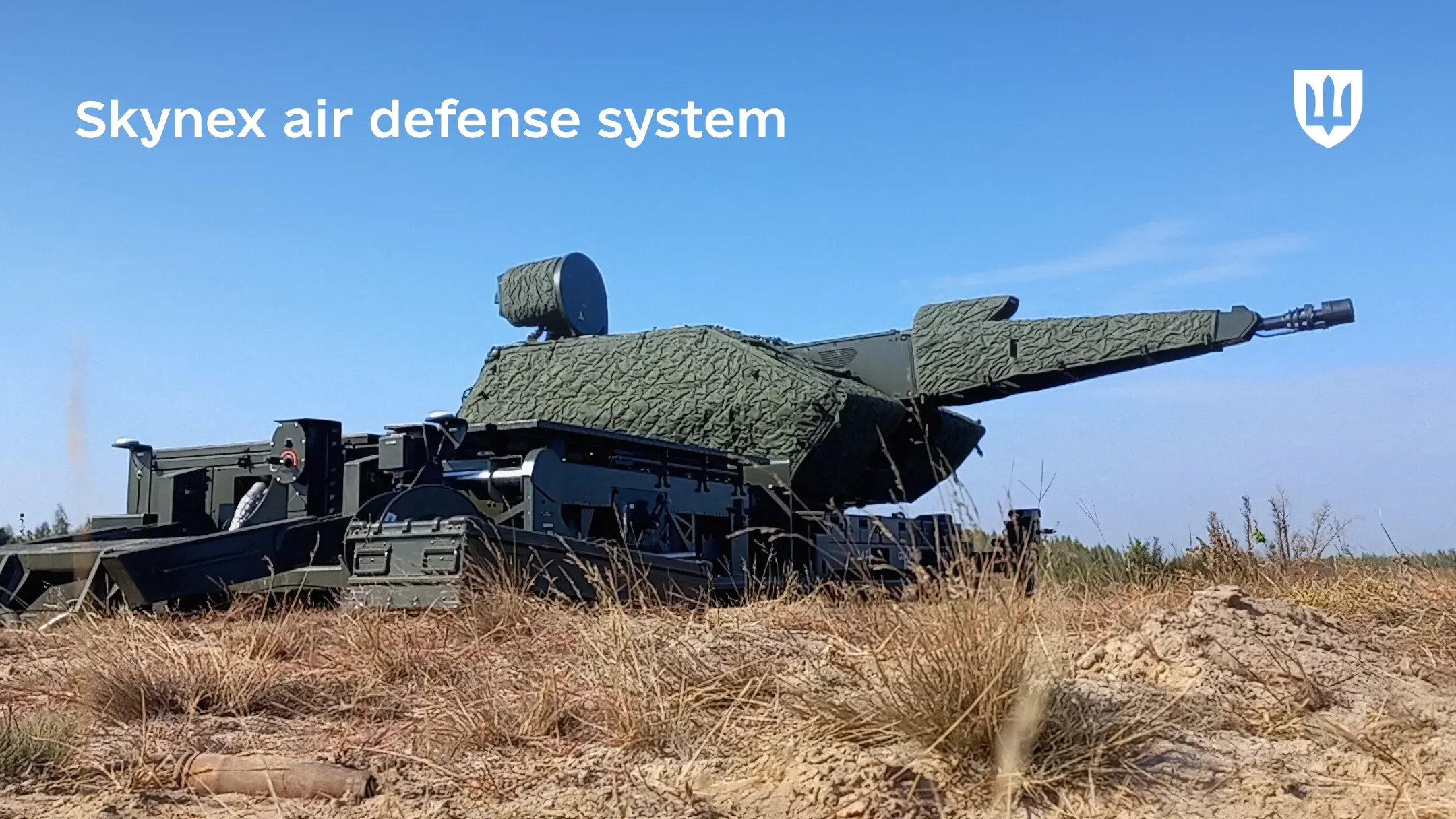 A German Skynex air defence system in open terrain under a clear blue sky