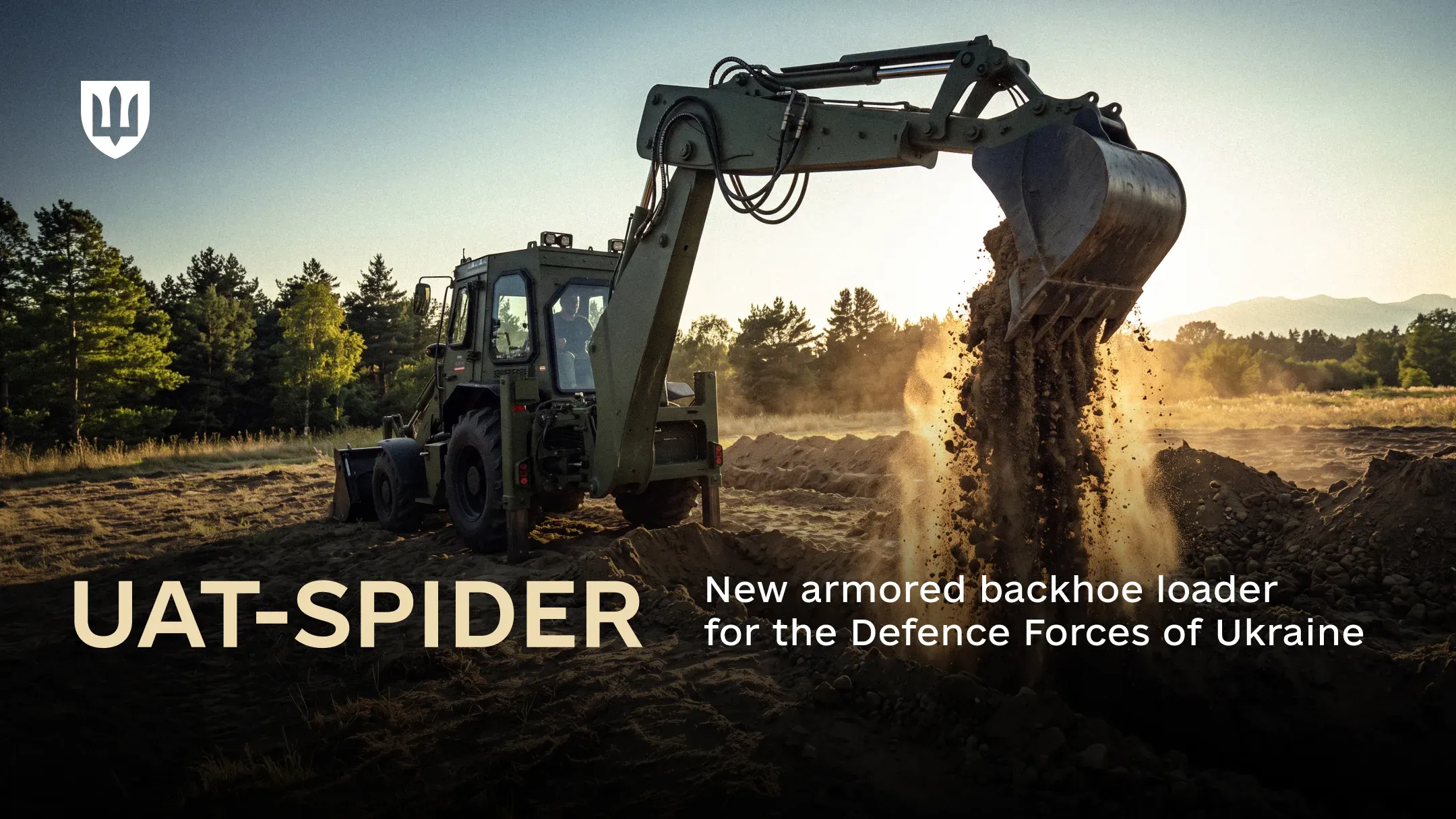 UAT-SPIDER armored backhoe loader dumping soil from its bucket in a field with a forest in the background
