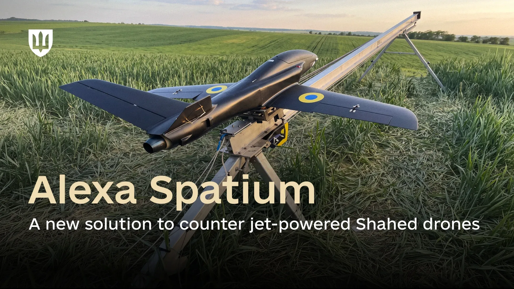 Black Alexa Spatium UAV on a launcher in a grassy field