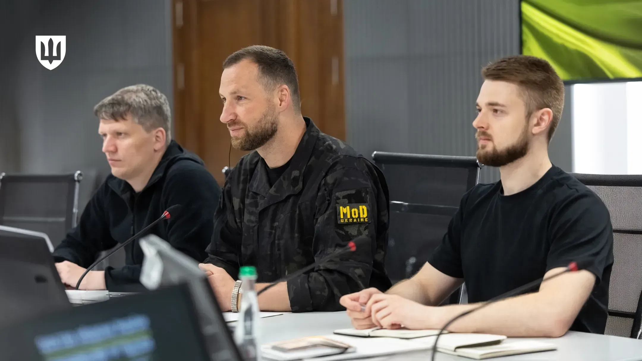 Acting Minister of Defence Evgeniy Khmara, centre, with two members of the Ukrainian delegation during talks with the German side