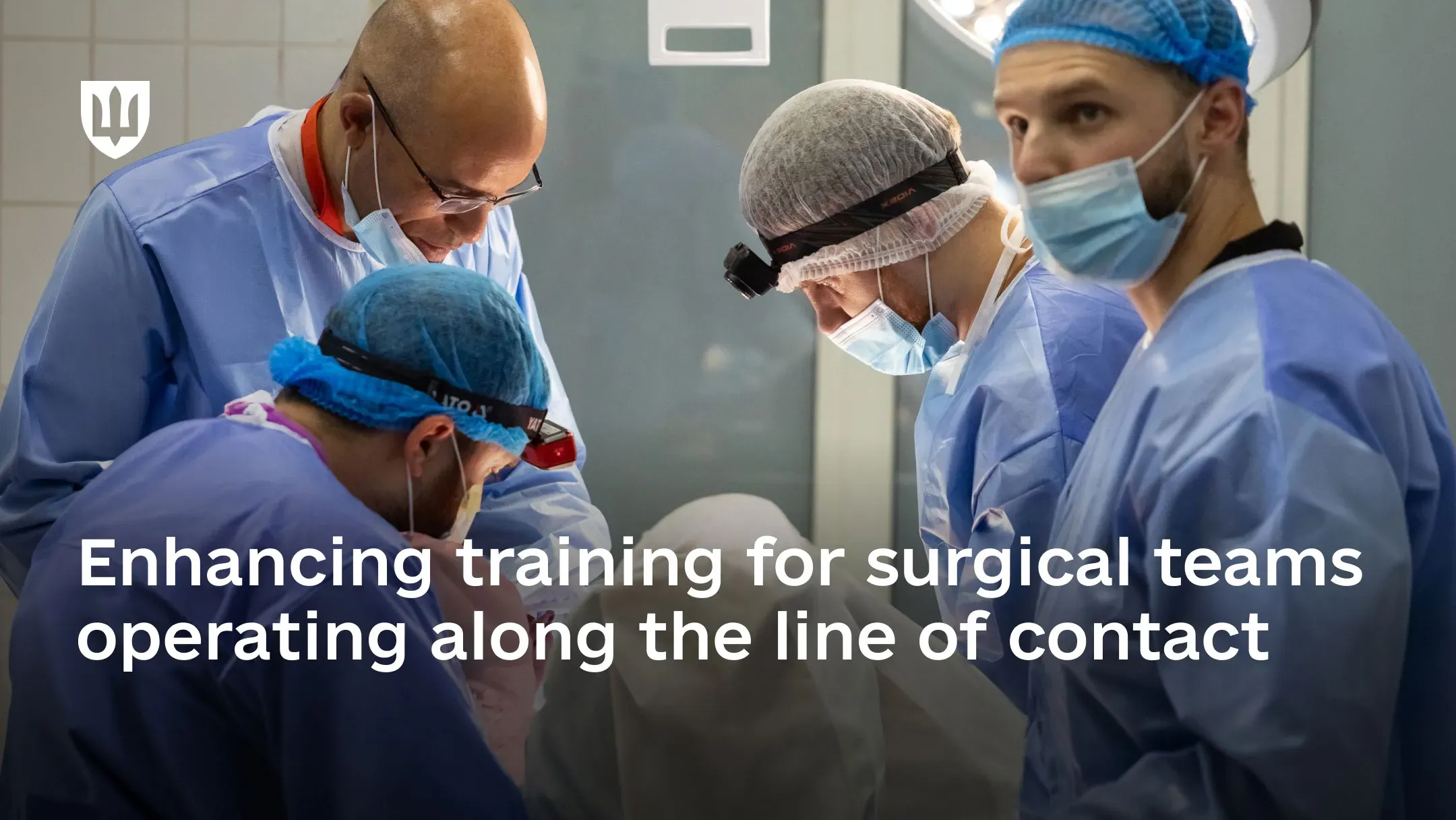 A surgical team works together during practical training in an operating room