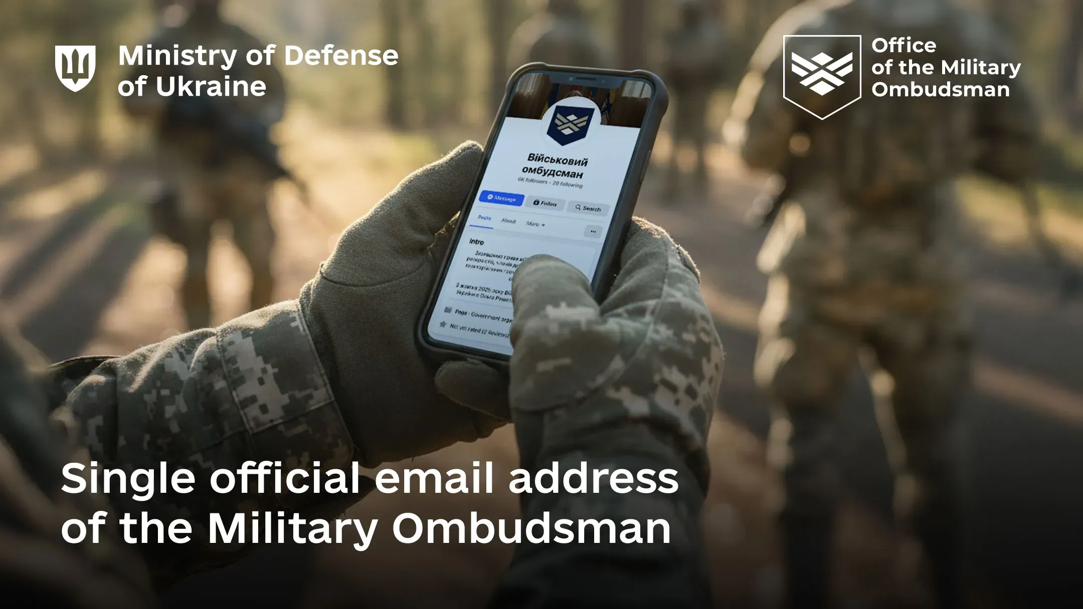 An illustrative photo shows a service member using an electronic device and looking at its screen