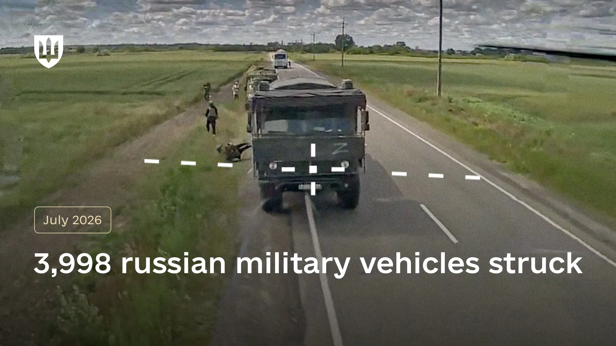 Drone camera image with a targeting reticle aimed at a military truck on a road, with a “Z” marking on the vehicle