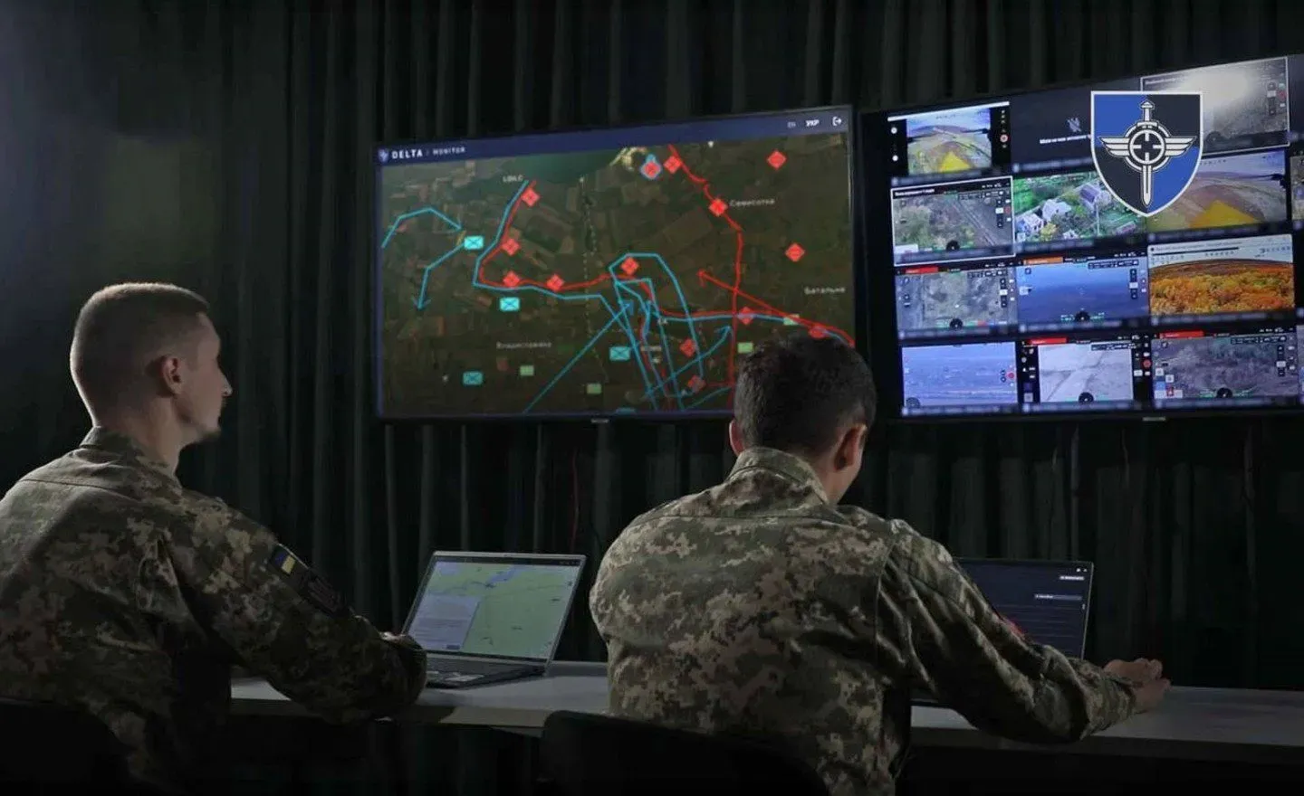 Ukrainian service members monitor screens displaying the DELTA ecosystem