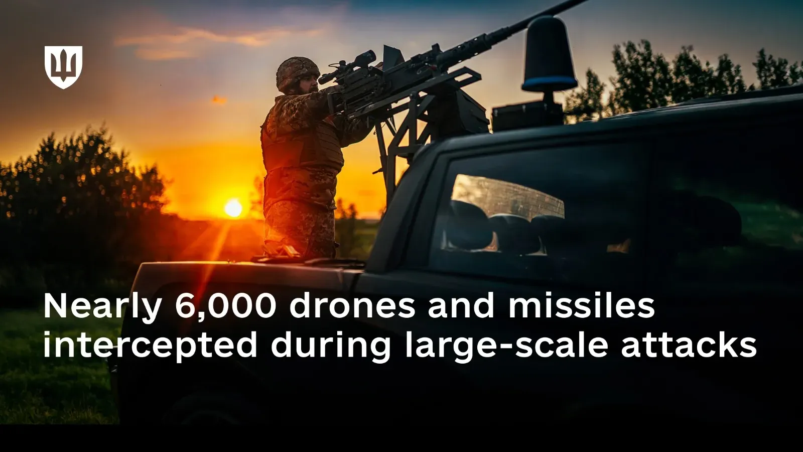 A member of a mobile fire group engages aerial targets against the backdrop of a sunset